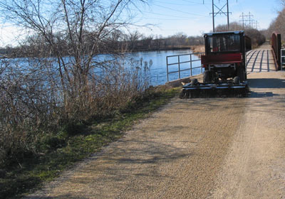 The Tow-Behind FlexSteel brush preps biking and hiking trails for the season ahead, by leveling out the aggregate, combing away any unwanted aggregate and debris, and refreshing the compacted soil for pleasant trails and paths.